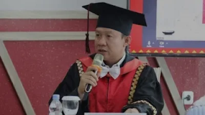 Sekdaprov Marindo Kurniawan Jadi Penguji Eksternal Sidang Promosi Doktor di Unila